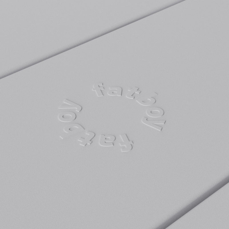 Close-up of Fredās table by Fatboy in light grey, showcasing its durable aluminum slats for a sleek and weather-resistant finish.