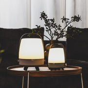 Lite-up Play by Kooduu: JBL-powered speaker and warm white lamp with minimalist aesthetics, brass details, and wooden handle.