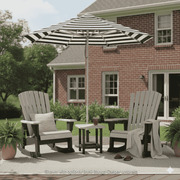 Outdoor patio set with two Krahn poly rockers and a striped basil bangsumbrella in front of a brick house