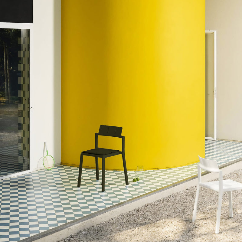 Outdoor setup featuring the Yard chair by TOOU Design, highlighting its versatility and polypropylene construction.