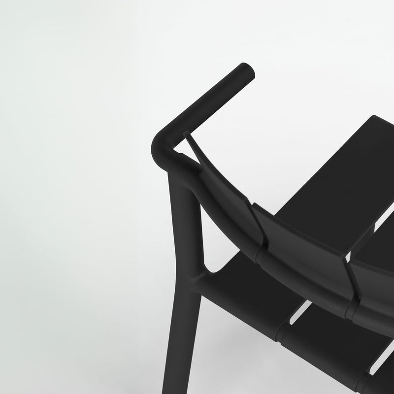 Yard counter stool with arms by TOOU Design, showcasing sleek lines and armrests for added comfort in any environment.