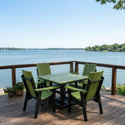 Krahn Dining Table with Krahn Modern Back Dining Chairs in the colour Lime with Black frame, on a deck overlooking the water