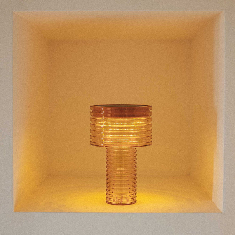 A portable solar lamp combining clean design, warm LED lighting, and up to 20 hours of wireless illumination.