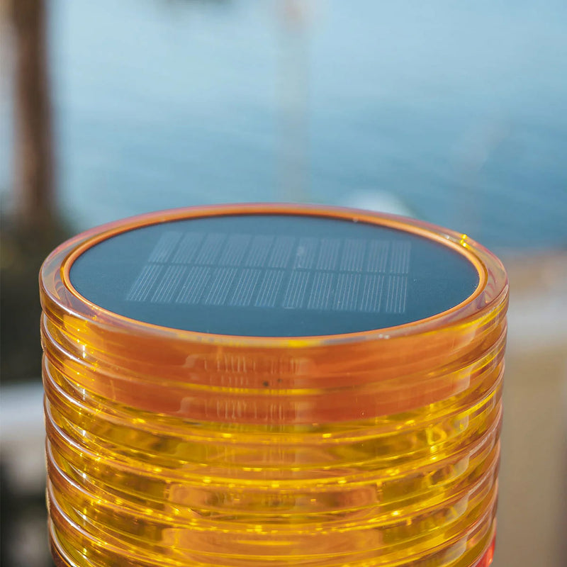 Solar-powered table lamp with three brightness levels, warm white light, and durable construction for indoor and outdoor use.