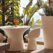 A refined outdoor table lamp offering solar recharge, cordless freedom, and soft 3000K ambient lighting.
