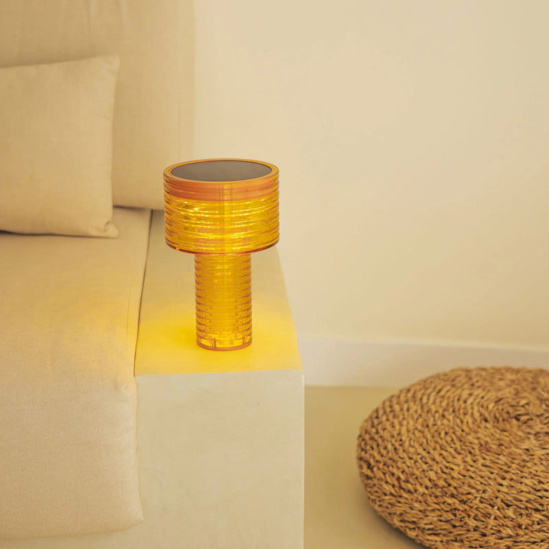 A versatile table lamp with solar and USB-C charging, warm LED glow, and up to 20 hours of light.