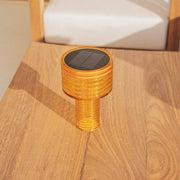 Minimalist solar table lamp designed for effortless lighting on patios, terraces, and indoor spaces.
