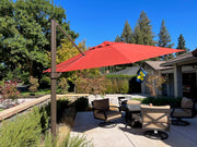 Frankford Cantilever Aurora 13 foot octagon umbrella in a backyard patio setting