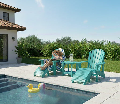 two aruba Krahn Adirondack Deluxe chairs with foot rests and end table in a backyard pool setting