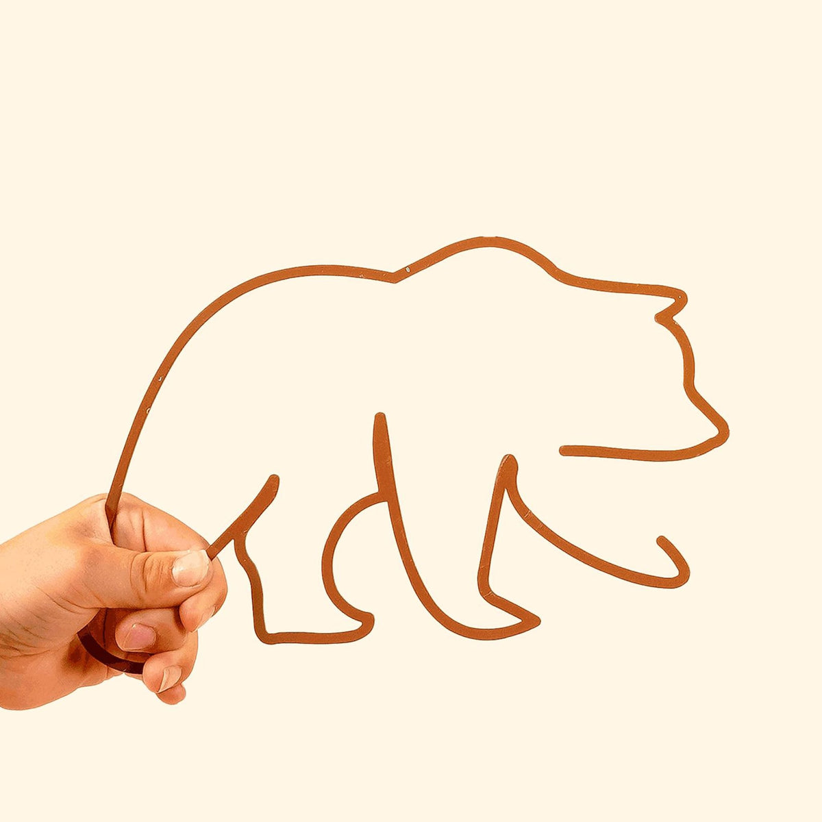 The Bear Line: Adorable metal silhouette featuring a playful bear, perfect for adding charm to children&#39;s spaces.