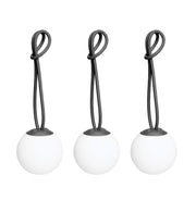 Bolleke Mini set of 3, with anthracite loop, brings warm, portable light to indoor and outdoor spaces.