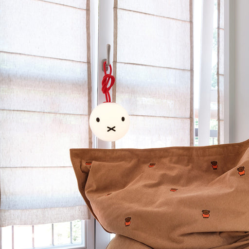 A portable LED lamp featuring Miffy’s iconic face and cozy 2700K light.