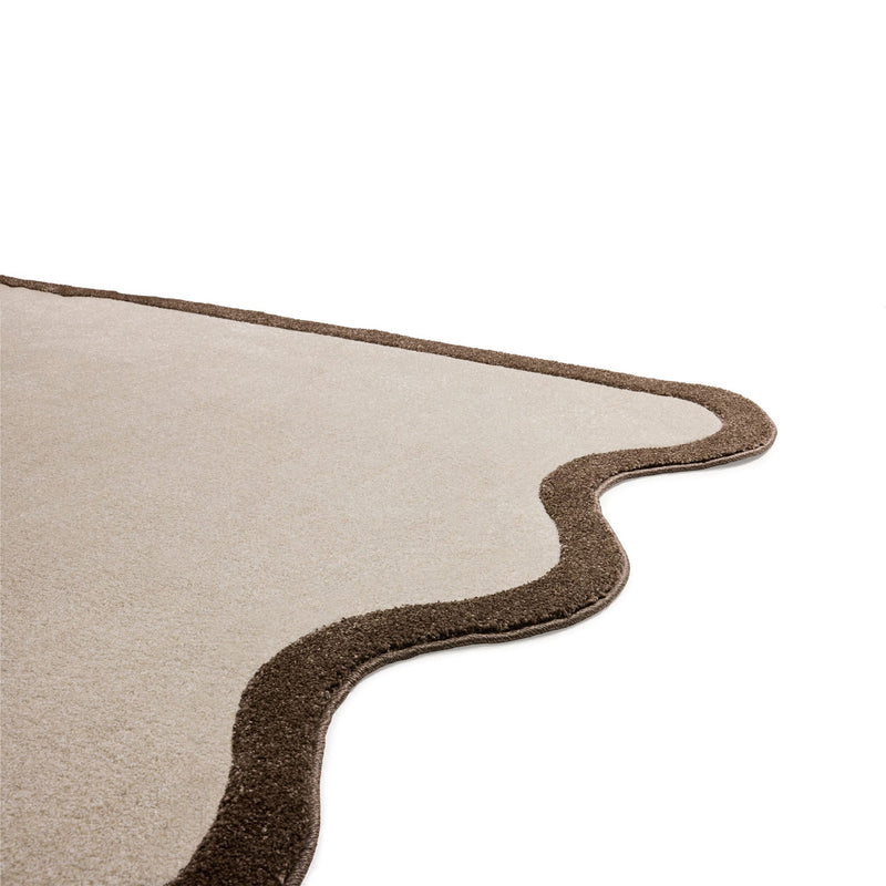 A compact designer rug with a gently wavy edge and calm tones.