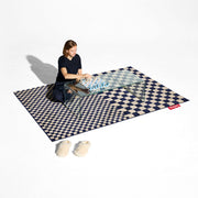 A graphic designer rug with a calm, balanced colour palette.