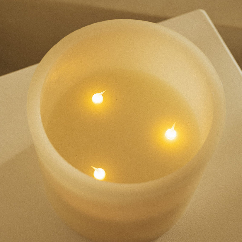 LED candle with realistic flicker effect, natural wax finish, and simple operation.