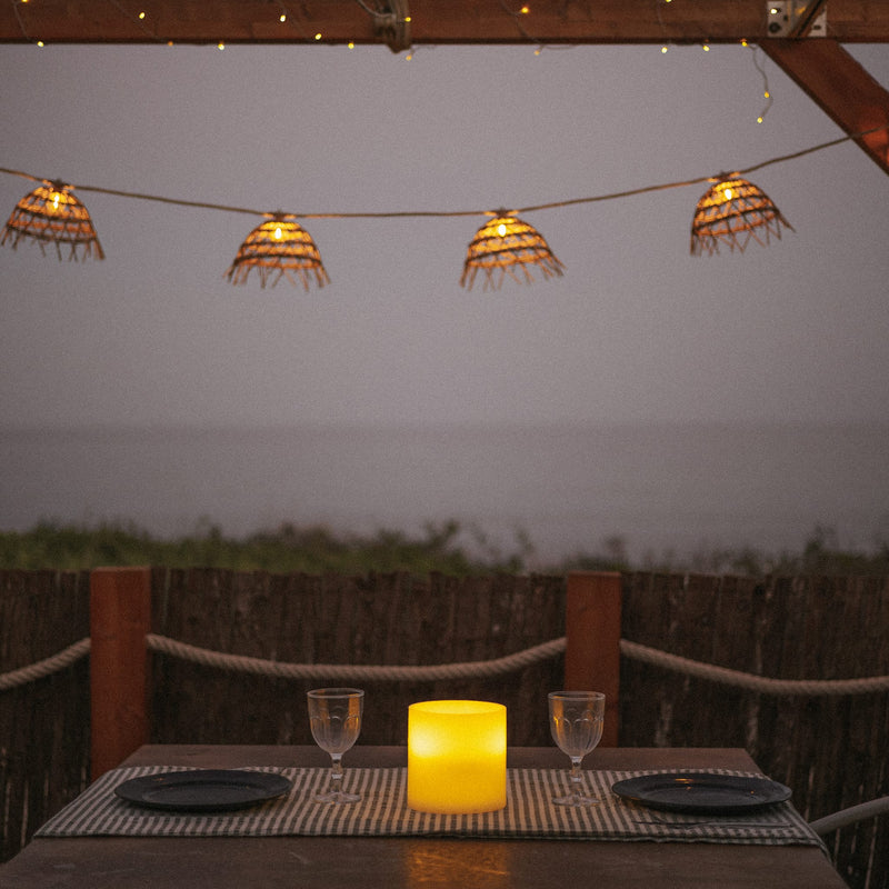 Compact candle-style lamp designed for refined, intimate lighting moments.