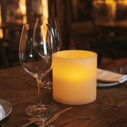 A refined LED candle offering warm light, remote control, and elegant ambiance without an open flame.