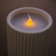 Elegant and safe, this flameless candle adds warmth to tables and shelves indoors or out.