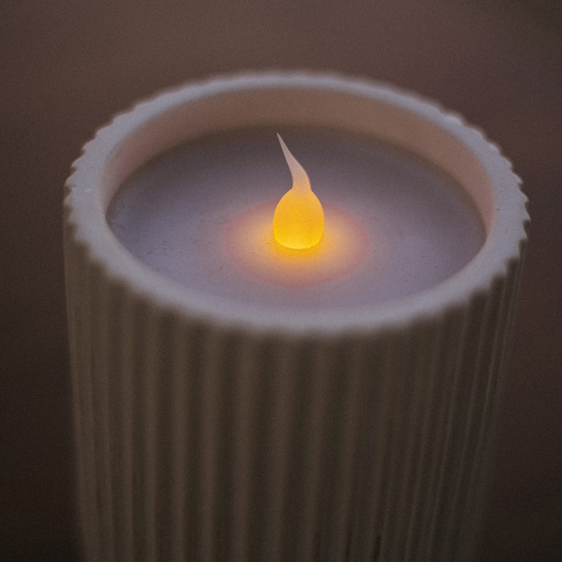 Elegant and safe, this flameless candle adds warmth to tables and shelves indoors or out.