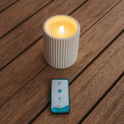 A modern LED candle combining ceramic elegance and realistic candlelight effect.
