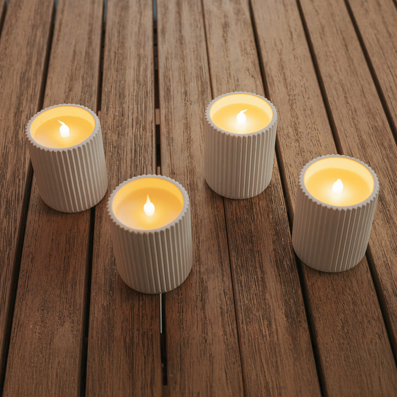 A compact ceramic LED candle offering warm glow, remote control, and timer function.