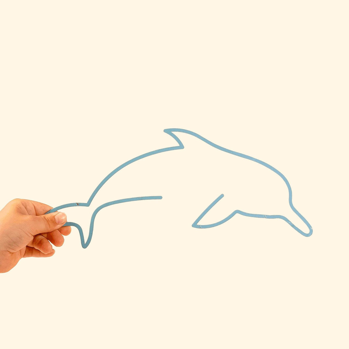 The Dolphin Line: Playful metal silhouette featuring a charming dolphin, perfect for adding whimsy to kids&#39; spaces.