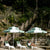 Stylish and durable Double Caspar Patio Umbrella featuring a white powder-coated aluminum frame and marine-grade components.
