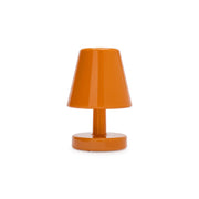 Edison the Ambiance in sunny orange is a wireless table lamp designed to create instant cozy lighting.