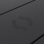 Close-up of Fred’s table by Fatboy in anthracite, showcasing its durable aluminum slats for a sleek and weather-resistant finish.