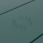 Close-up of Fred’s table by Fatboy in dark sage, showcasing its durable aluminum slats for a sleek and weather-resistant finish.