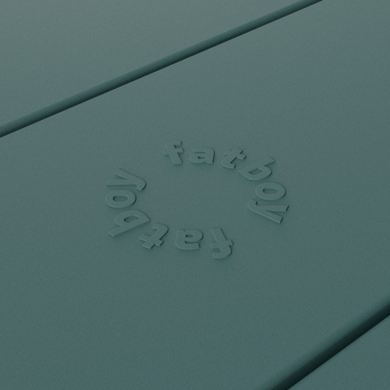 Close-up of Fred’s table by Fatboy in dark sage, showcasing its durable aluminum slats for a sleek and weather-resistant finish.