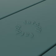 Close-up of Fred’s table by Fatboy in dark sage, showcasing its durable aluminum slats for a sleek and weather-resistant finish.