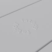 Close-up of Fred’s table by Fatboy in light grey, showcasing its durable aluminum slats for a sleek and weather-resistant finish.