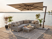 Krahn modular sectional with Sunbrella cushions with an FIM umbrella on a patio overlooking the water. 