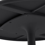 Close-up of Fred’s Bistreau table’s durable aluminum slats and cast-iron base for a sleek and sturdy outdoor look.