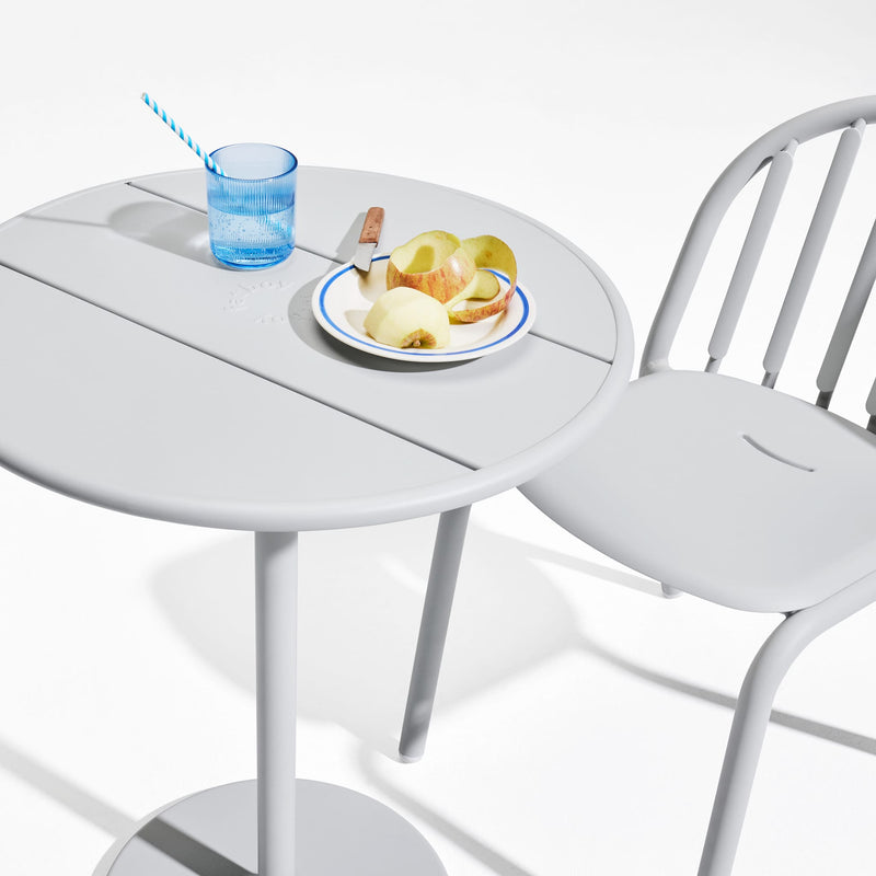 Fred's Bistro Set showcasing ergonomic chairs and a stable table, crafted for outdoor use in all weather conditions.