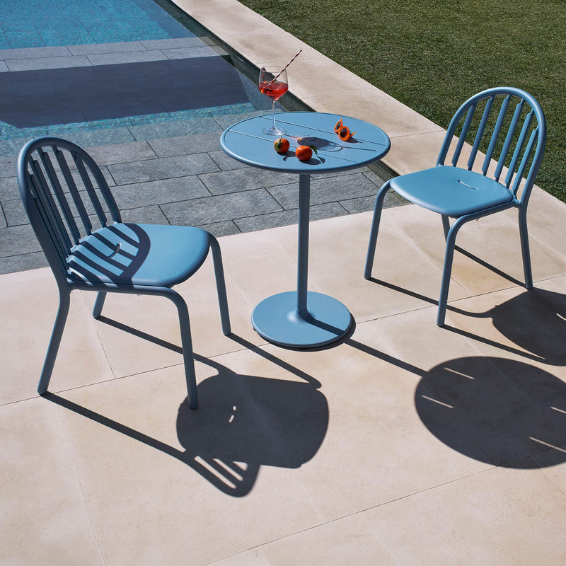 Modern Fred's Bistro Set by Fatboy providing a chic and practical solution for small outdoor spaces.