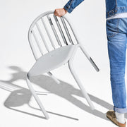 Lightweight Fred’s Chair being moved easily, showcasing its portability and user-friendly design.