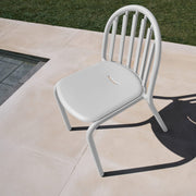 Fred’s Chair on a garden patio, demonstrating its durability and UV-resistant coating against sunlight exposure.