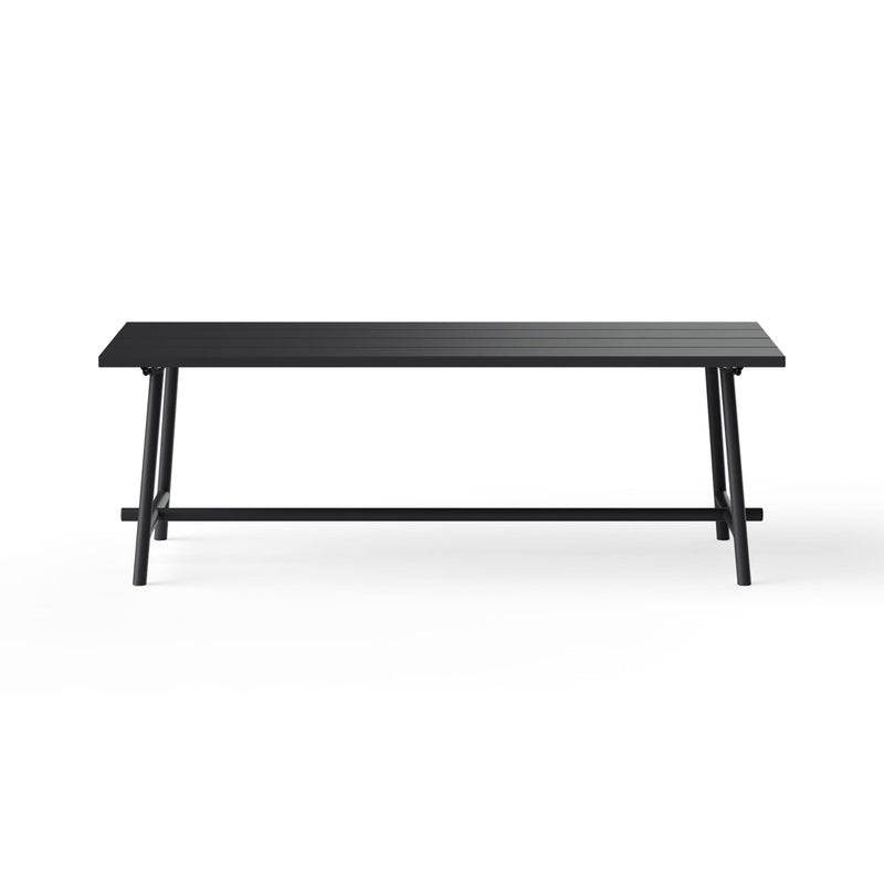 Fred’s Outdoor Table as the centerpiece of a rooftop terrace, combining modern design with functional durability.