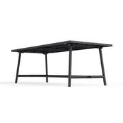 Foldable legs of Fred’s Outdoor Table, emphasizing its compact storage solution for colder months or smaller spaces.