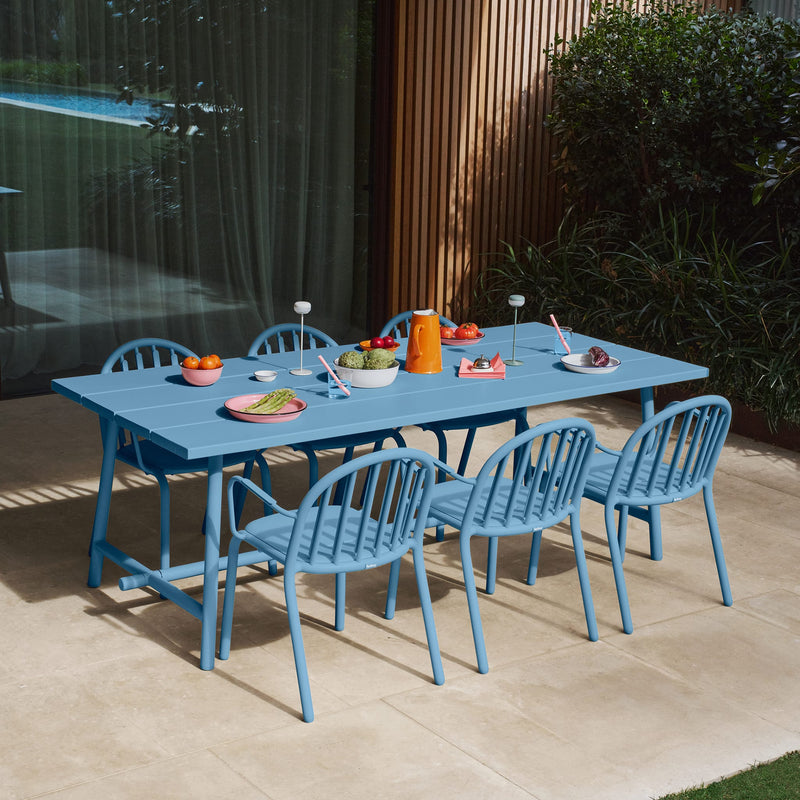 Fred’s Outdoor Table paired with Fred’s Chairs, creating a stylish and functional outdoor dining setup.