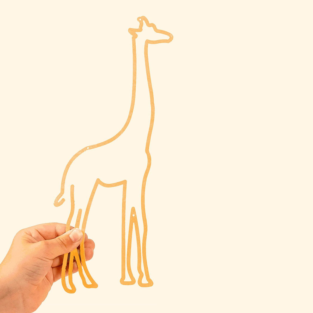 The Giraffe Line: Elegant metal silhouette featuring a playful giraffe, perfect for adding charm to kids&#39; spaces.