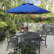 Frankford Greenwich 6.5' Square Pacific Blue Umbrella in a dining table on a patio