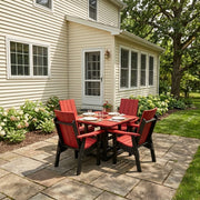 Krahn Dining Table 40"x40" with four Krahn Modern Back Dining Chairs in the colours Apple Red and Black on a backyard patio
