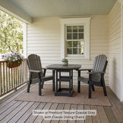 Krahn Dining Table set with two Classic Dining Chairs in the colour Coastal Gray with Black frame on a porch