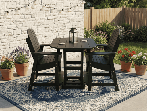 Outdoor patio set with krahn outdoor poly bistro table and chairs on a rug, surrounded by potted plants.