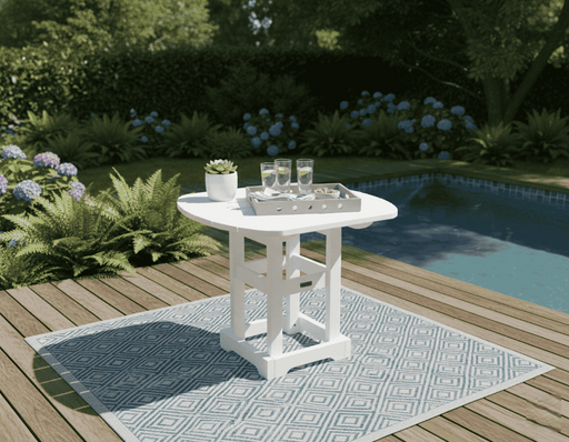 Krahn 34" x 36" dining table with drinks on a patio by a pool