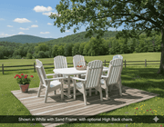 Krahn outdoor dining set with white chairs and table on a wooden deck, surrounded by greenery and mountains.