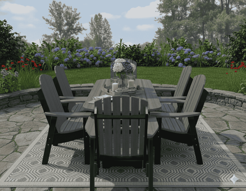 Krahn outdoor patio set with table and chairs on a stone patio with garden in the background